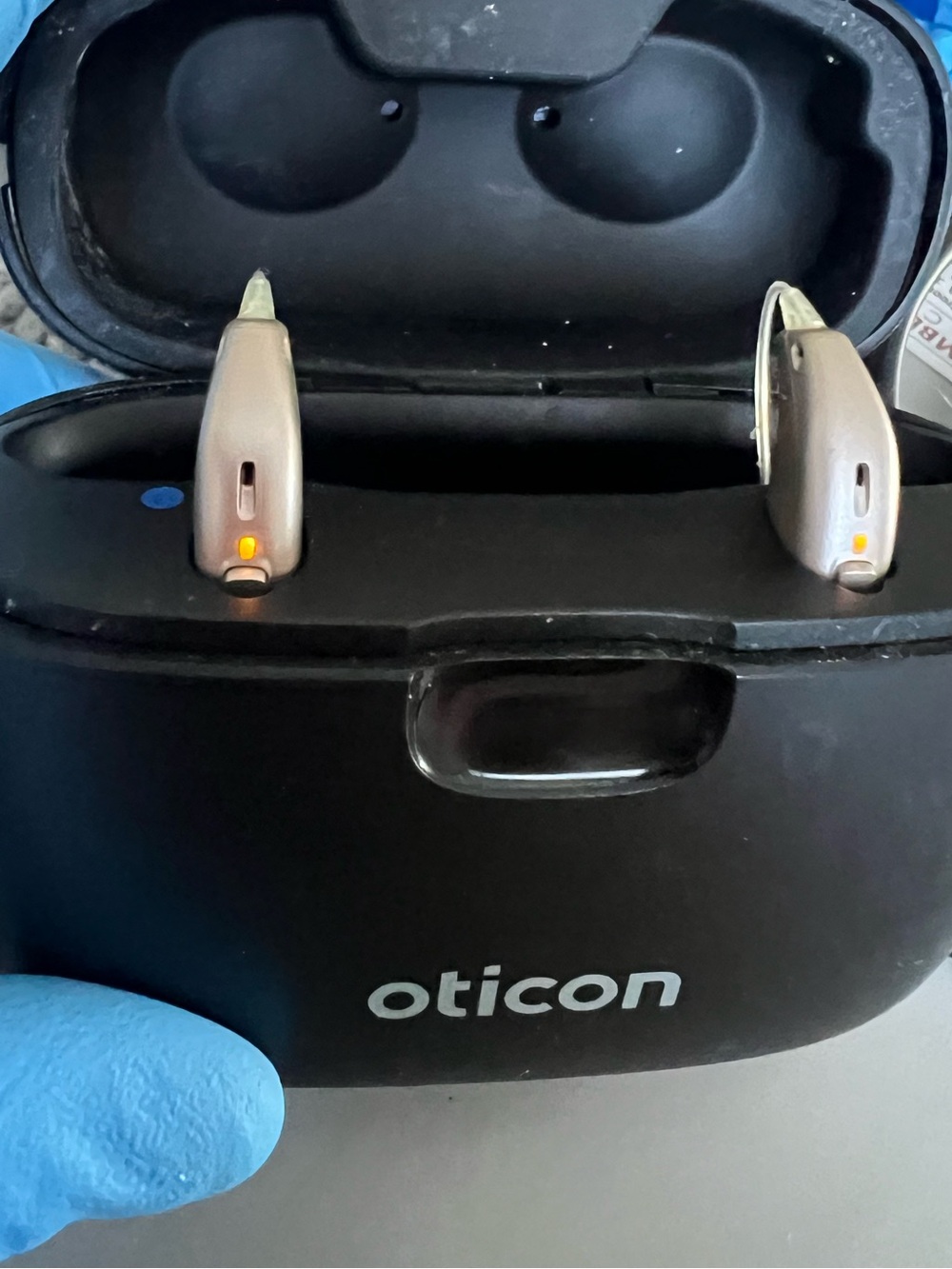 2 Rx Oticon RIC Real1 Hearing Aids w/ docking station good condition